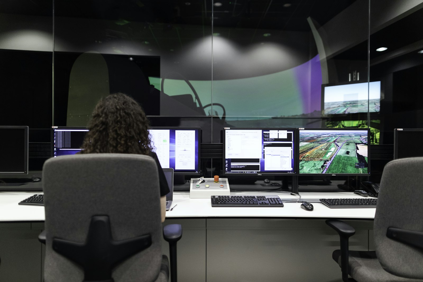 Operators monitoring assets in an operations control room