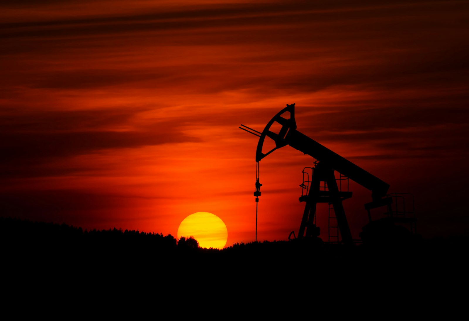 Pumpjacks silhouetted at sunset