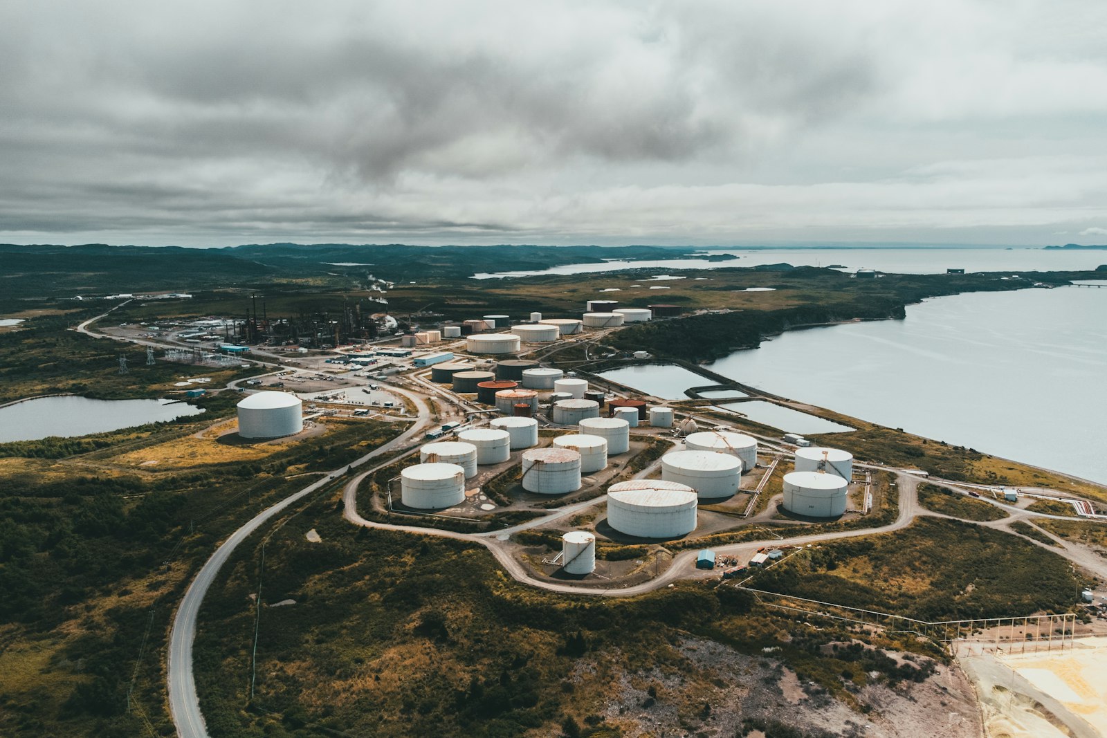 Aerial view of storage tanks at a coastal terminal